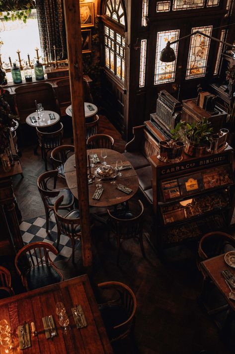 Cool Restaurant Design Interiors, 1920s Cafe Interior, Apothecary Cafe Coffee Shop, Apothecary Cocktail Bar, Grunge Coffee Shop Aesthetic, Moody Bakery Interior, Gothic Coffee Shop Aesthetic, Aesthetic Shops Interior, 1920s Coffee Shop