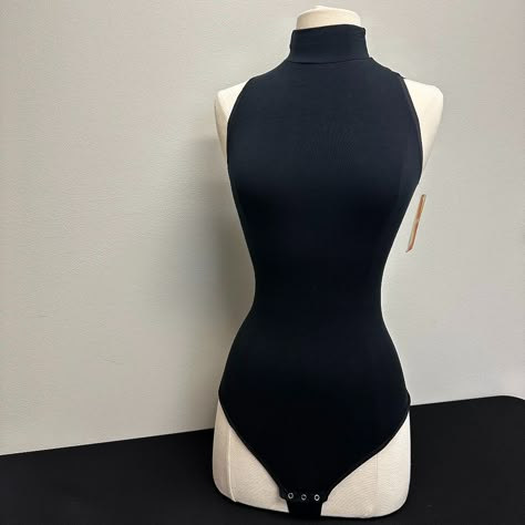 This Sleeveless Mock Neck Bodysuit Adds A Sexy Look To Jeans, Pants, And Skirts, While Comfortably Smoothing Your Tummy With Its Hugging Features. Measurements Length - 28 Inches Bust - 34 Inches *Small Hole Cat Suit Outfit, Tank Top Bodysuit Outfit, Turtleneck Tank Top Outfit, One Piece Body Suit Outfit, Vigilante Outfit, Sleeveless Bodysuit Outfit, Persona Moodboard, Sleeveless Turtleneck Bodysuit, Bodysuit Outfit Ideas