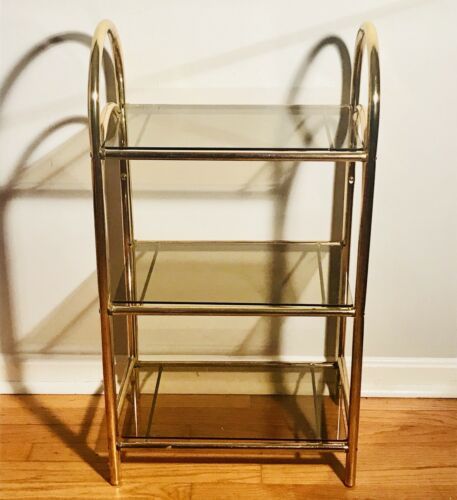 Vintage 80s Shelf Gold Forged Brass 3 Tier Smoked Glass Hollywood Regency MCM | eBay Gold Shelf, Vanity Shelf, Vintage Apartment Decor Ideas, Vintage Hollywood Bedroom, 80s Decor Interior Design, Old Hollywood Aesthetic Room, Vintage Shelves, Vintage Salon Decor, Vintage Glam Decor