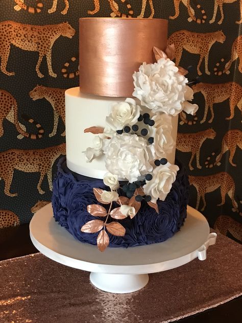 Rose gold and navy blue wedding cake, coordinating sugar flowers Navy Blue Purple And Rose Gold Wedding, Navy Blue And Rose Gold Cake Ideas, Navy Blue And Rose Gold Cake, Navy And Rose Gold Wedding Cake, Rose Gold Navy Blue Wedding Cake, Navy Blue And Rose Gold Birthday Party, Navy Blue And Rose Gold Party Decor, Navy And Rose Gold Decorations, Blue Gold Wedding Cake