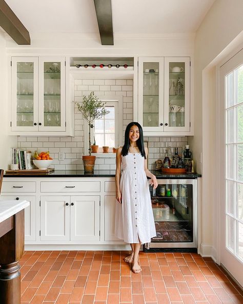 Patti on Instagram: ““Oh that’s different?” “There’s a reason why people don’t install terra cotta tile floors in the midwest.” I guess if we would’ve…” Divided Living Room, Terracotta Tiles Kitchen, Terracotta Tile Floor, Narrow Living Room, Terracotta Floor, Black Countertops, Glass Front Cabinets, Large Kitchen Island, Terracotta Tiles