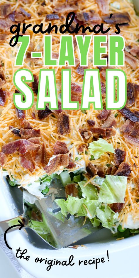 dish full of 7 layer salad with scoop Layered Garden Salad, Pea Layered Salad, 7 Layer Salad With Broccoli, Easy Seven Layer Salad, Layered Lettuce Salad Recipes, Layered Lettuce Salad With Peas, Southern 7 Layer Salad, Overnight Salad Layered, 7 Layer Salad With Cauliflower