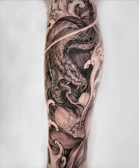 Snake and lotus black and grey on the leg Hon Tattoo Snake Calf Tattoo, Snake Tattoo Sleeve, Tiger Forearm Tattoo, Calf Sleeve Tattoo, Dragon Tattoo Shoulder, Black Lotus Tattoo, Animal Sleeve Tattoo, Astronaut Tattoo, Dibujos Tattoo