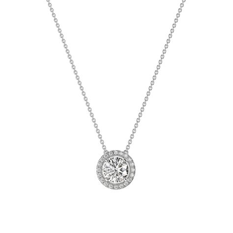 Presenting our 1 CT Round Halo Moissanite Diamond Necklace, a perfect gift for her. This exquisite necklace features a stunning round halo design, combining the brilliance of moissanite and the allure of a diamond halo. It's a timeless piece that adds elegance to any outfit. Make her day special with this beautiful Moissanite Pendant. Necklace Details: » Necklace Length: 16 Inches + Adjustable 2 Inches » Stone Size: Center Stone 0.5CT (5MM) 1 CT (6.5MM) Or 2 CT (8MM)  » Base Metal: Solid Genuine Moissanite Pendant, Halo Necklace, Wedding Pendant, Pendant Diamond, Round Halo, Detailed Necklace, Halo Design, Moissanite Necklace, Moissanite Earrings