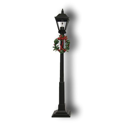 PRICES MAY VARY. DECORATIVE LAMP POST The Lamppost plugs in and is a wonderful display piece to complement any outdoor Caroler grouping. We like to place them in our windows during the holidays with a grouping of Carolers. Additional flicker bulbs are available. Lamp Post Christmas Decor, Christmas Light Post, Post Christmas Decor, Sidewalk Lighting, Christmas Lamp Post, Paris Christmas, Christmas Lamp, Christmas Program, Wreath Decoration