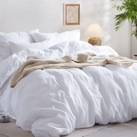 PRICES MAY VARY. Plain and Simple: Yarn-dyed for a simple yet elegant look, this duvet cover set features a subtle dual color effect, instantly refreshing your home decor with classic style. Made with Pure Cotton: Made with 100% pure cotton, this cotton duvet cover set offers exceptional breathability with extra softness to provide the utmost coziness year round. Prewashed Texture: This washed cotton duvet cover set has been prewashed to achieve a naturally relaxed look that adds an extra layer White Down Comforter Bedroom, All White Bedding, White Fluffy Bedding, 100 Cotton Duvet Covers, Queen Size Duvet Covers, King Size Duvet Covers, White Comforter, White Duvet, Full Duvet Cover