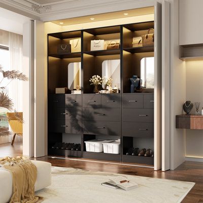 Designed as a versatile closet system, this free-standing organizer features a sleek mirror, ample drawers, and shelves, all crafted from high-quality woodboard construction for durability and style. The integrated mirror not only adds a touch of modern sophistication but also offers a practical way to check your look before heading out. Our closet system features multiple drawers, each designed to handle a variety of items with ease. These drawers are perfect for storing smaller essentials such Closet System With Drawers, Freestanding Closet, Small Closet Organization Bedroom, Hidden Closet, Closet Storage Systems, Black Closet, Custom Closet Design, Free Standing Closet, Beautiful Closets