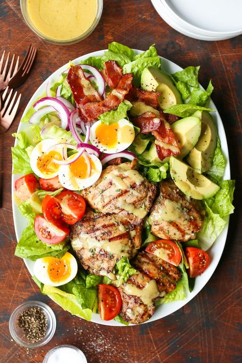 Check out our roundup of must-eat summer salad recipes that will impress your friends and your kids. These dishes put the fun back on your plate! #salad #easysaladrecipes #saladrecipes #summersalads #saladrecipeshealthy #summersaladrecipies Garlic Rosemary Chicken, Chicken Cobb Salad, Pasti Fit, Dijon Dressing, Resep Salad, Honey Dijon, Rosemary Chicken, Think Food, Easy Salads