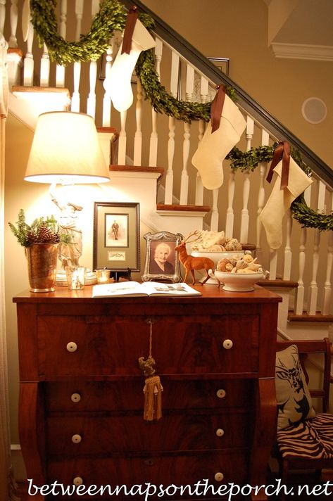 Banister Decorated with Preserved Boxwood Garland and Stockings Stockings On Banister, Stockings On Staircase, Refinish Stairs, Beautiful Staircases, Christmas Banister, Hanging Christmas Stockings, New Staircase, Christmas Interiors, Hanging Stockings