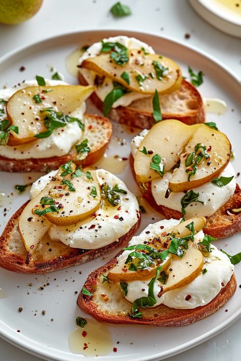 Indulge in the refined simplicity of our Gluten-Free Pear and Burrata Crostini, a delightful blend of fresh, organic ingredients and artisanal quality. This recipe, perfect for the Whole Health Flexi-Plan diet, offers a gourmet experience with healthful benefits. Each bite delivers a fusion of sweet, juicy pear and creamy, luxurious burrata on top of crisp, golden-brown gluten-free crostini. Burrata Crostini, Snack Dip Recipes, Gluten Free Baguette, Gourmet Gluten Free, Burrata Recipe, Gluten Free Vegetarian Recipes, Burrata Cheese, Vegetarian Cooking, Healthy Appetizers