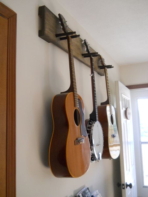 DIY guitar hanger - simple & secure! We practice so much more since we've put this up. Music Studio Room Diy, Hang Guitar On Wall, Guitar Stand Wall, Diy Guitar Stand, Ruang Studio Musik, Guitar Holder, Guitar Storage, Guitar Wall Hanger, Guitar Display