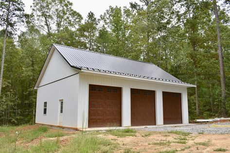 This 32'x40'x12' garage was built in Midlothian, VA, by Superior Buildings. White Metal Garage Buildings, White Metal Garage, Barn Garage Ideas, Freestanding Garage, Detached Garage Designs, Metal Garage Buildings, Work Shop Building, Shed Tiny Home, Metal Shop Building