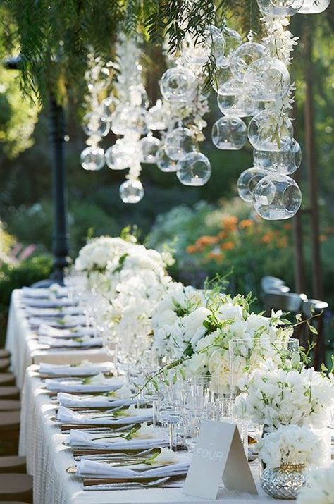 glass orb terrariums wedding reception decor / http://www.himisspuff.com/hanging-glass-globes-wedding-decor-ideas/2/ Colin Cowie Wedding, Decoration Evenementielle, Festa Party, Banquet Tables, Long Table, Deco Floral, Wedding Tablescapes, Wedding Table Centerpieces, The Ceiling