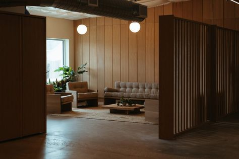 KKDW Studios creates offices for a yoga teacher in Austin Yoga App, Angled Ceiling, Cosy Lounge, Glazed Walls, Large Tables, Studios Photography, Bright Kitchens, Lounge Area, Studio Space