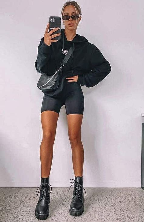 Biker Shorts Game Day Outfit, Shorts And Chunky Boots, Bike Shorts And Doc Martens, Biker Shorts Long Sleeve Outfit, Biker Shorts Jumpsuit Outfit, Biker Shorts Airport Outfit, All Black Biker Shorts Outfit, Biker Shorts Combat Boots Outfit, Trendy Biker Shorts Outfit