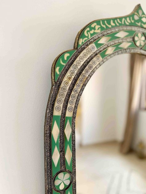 Vintage Moroccan Mirror | Arch Bone inlay Wall Mirror, Green Frame Mirror, Bathroom Mirror, living room Mirror, Bedroom Mirror , Home DecorStep into a world of exotic elegance with our luxury Moroccan wall mirror. Carefully crafted by our team of skilled artisans, this breathtaking piece is a stunning fusion of bone and brass, showcasing intricate Berber and Moroccan engravings that evoke the rich cultural heritage of North Africa.The solid bone frame is adorned with intricate Berber engravings Standing Mirror In Living Room, Frame Mirror Bathroom, Arch Mural, Moroccan Mirrors, Tile Mirror Frame, Heritage Decor, Mirror Arch, Unusual Mirrors, Arch Wall Mirror