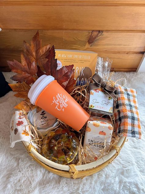 Boo Basket $40 Includes woven basket, kitchen towel, novel by Fredrik Brackman, fall leaf pic, coffee to go cups, sea salt caramels, candle, socks, 2pk of soap and candy dish full of chocolates! Fall Baskets For Teachers, Leaf Pic, Fall Basket Ideas, Thanksgiving Basket, Pictures Of Leaves, Thanksgiving Baskets, Sea Salt Caramels, Fall Basket, Fall Gift Baskets