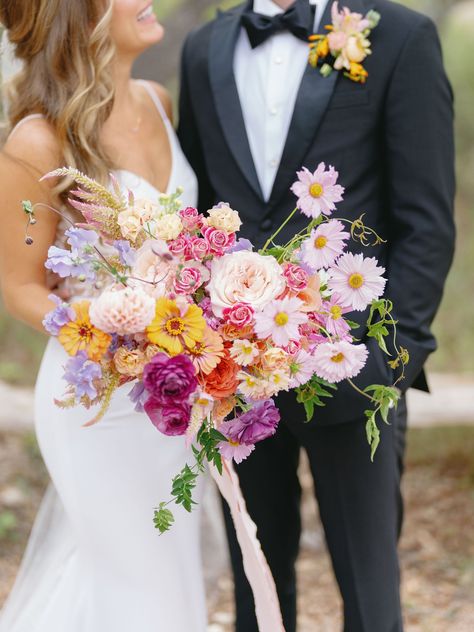 Bride Holding Large Bright and Pastel Bouquet of Purple, Pink, Yellow, Orange, Yellow and Lavender Pink Orange Yellow Wedding, Orange Purple Wedding, Yellow And Lavender, Pink Purple Wedding, Winter Bridal Bouquets, Bridal Bouquet Summer, Pastel Bouquet, Peach Wedding Flowers, Lavender Bouquet