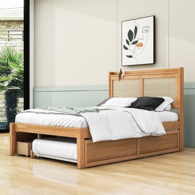 Designed for those who appreciate both aesthetics and practicality, this bed features an intricately woven rattan headboard with customizable LED lighting, creating a tranquil atmosphere for relaxation. The cleverly designed pull-out trundle offers a convenient solution for overnight guests, while two large storage drawers help maintain a tidy and clutter-free bedroom.Actual colour may vary slightly due to photographic lighting sources or your monitor settings. Bay Isle Home™ Size: Full/Double, Queen Bed With Queen Trundle, Small Bedroom Bed Frames, Rattan Trundle Bed, Double Bed With Trundle, Full Size Trundle Beds, Box Bedrooms, Full Size Trundle Bed, Full Bed With Trundle, Full Bed Headboard