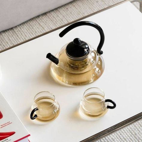 Elevate your tea time with our modern transparent and black Japanese-style tea pot and tea cups. Embrace the art of tea drinking with sleek design and timeless elegance. 🍵✨ . . . #TeaTime #JapaneseStyle #ModernElegance Tea Pot Aesthetic, Tea Set Aesthetic, Modern Tea Set, Glass Tea Pot, Art Of Tea, Glass Tea Set, Cha Bar, Shoe Rack Living Room, Teapot Set