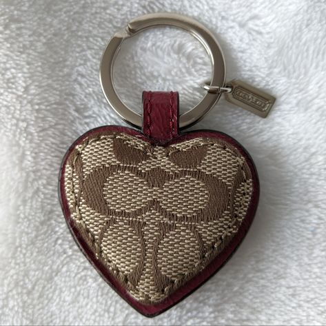 Nwot Coach Signature Heart Keyring / Bag Charm. Features Signature Canvas Trimmed In Burgundy Leather. Approximate Measurements Not Including Keyring 1 3/4"(W) X 1 1/2"(H). Beautiful Keyring! Coach Bag Charms, Coach Bag Charm, Mini Duffle Bag, Leather Lanyard, Shoe Nails, Heart Keyring, Pink Swarovski, Leather Key Fobs, Aesthetic Things