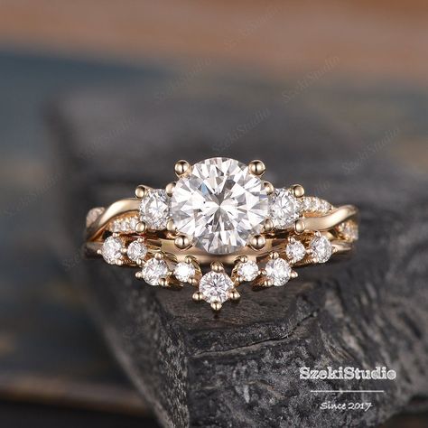 "Three Stone Moissanite Engagement Ring Set Infinity Rose Gold Cluster Moissanite Ring Twist Diamond Half Eternity Ring Bridal Woman Promise ITEM INFORMATION Metal Type - Solid 14k Rose Gold Band Width - (approx. 1.8mm) Engagement ring: Center Stone - 7mm Moissanite, Round Cut Clarity - VVS Color - D-E-F Side Stone - Moissanite Weight - 0.2ct Clarity - D-E-F Color - VVS Accent Stone -Natural Diamonds Weight - 0.1ct Clarity - SI Color - H Wedding Band: Stone -Natural Diamonds Weight - 0.24ct Clar White And Rose Gold Engagement Rings, Wedding Band Twisted Engagement Ring, Rose Gold Engagement Ring And Wedding Band, Flower Engagement Ring With Wedding Band, Unique Rose Gold Rings, Moissanite Engagement Ring And Wedding Band, Wedding Rings Engagement Infinity, Two Band Wedding Ring Set, Yellow Gold Bridal Set