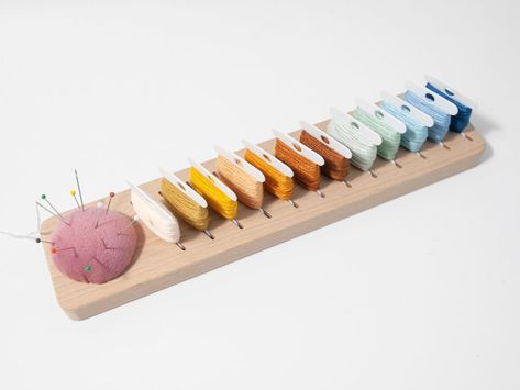 PRICES MAY VARY. Our floss bobbins organizer is made of sturdy and durable beech wood with a smooth sanded surface Our floss organizer boasts 12 positions, providing ample space for your embroidery floss bobbins. The thoughtful design allows you to categorize and arrange your threads systematically, making your crafting process more efficient. Convenient pin cushion provide a safe place to store needles and pins.keeps your pins and needles safe and within reach Exceptional Value - Spend less tim Embroidery Floss Organizer, Embroidery Floss Storage, Floss Bobbins, Floss Organizer, Needle Organizer, Hobby Storage, Embroidery Bobbins, Sewing Supplies Storage, Pins And Needles