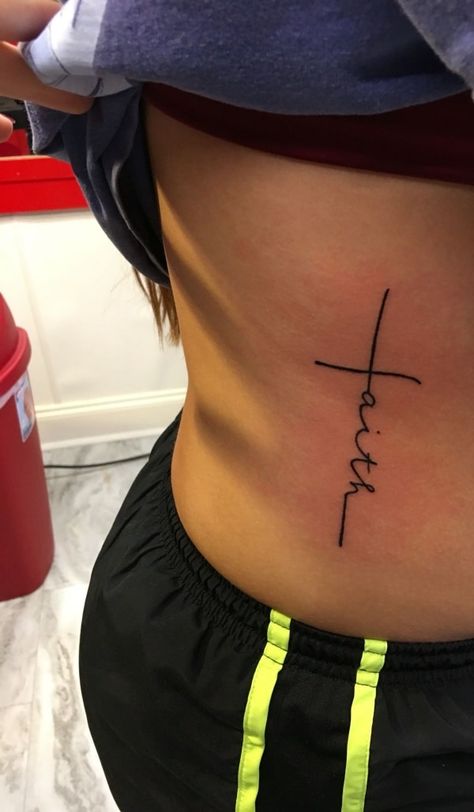 54 Beautiful Faith Tattoo Designs For You In 2021 – Artistic Haven Faith Tattoo Side Rib, Faith Tattoo Ribs, Faith Tattoo On Ribs, Cross On Side Ribs, Faith Rib Tattoo, Blessed Rib Tattoo, Small Side Stomach Tattoos, Cross Stomach Tattoo, Tatoos Woman Ribs