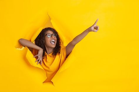 Photo crazy happy pointing. cheerful afr... | Premium Photo #Freepik #photo #scared-face #afro-woman #shocked-woman #surprised-woman Yellow Paper Background, Surprised Woman, Scared Face, Yellow Paper, Facial Expression, Human Emotions, Facial Expressions, Paper Background, Young Woman