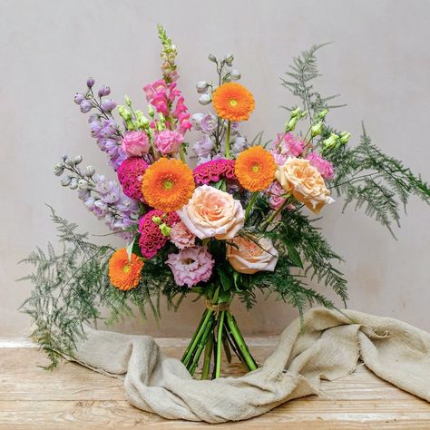 Colourful fresh flowers bouquet with purple delphinium, orange gerbera and ppink snadragon Bright Coloured Bouquets, Bouquet Colour Palettes, October Wildflower Bouquet, Colour Bouquet, Colourful Wedding Flowers, Garden Style Bouquet, Summer Flower Bouquet, Congratulations Flowers, Multicolor Wedding