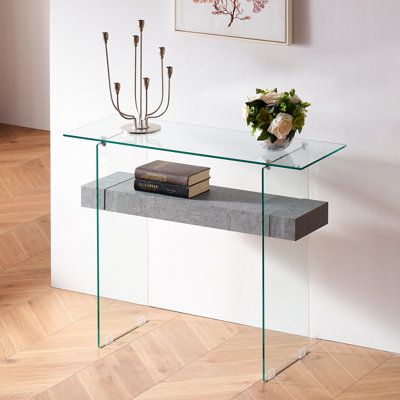 The epitome of elegance, this rectangular modern glass console table was inspired by treasures in London's design Museum. Ideal for the living room, hall, or foyer, its chic geometric lines were designed with a natural wood finish and transparent glass. Table Top Color: Gray | Orren Ellis Narrow Glass Console Table w/ Storage Modern Sofa Table Entryway Table | Wayfair Glass Top Console Table, Desk Tv, Slim Console Table, Console Table With Storage, Small Writing Desk, Modern Sofa Table, Small Computer Desk, Long Console Table, Table Entryway