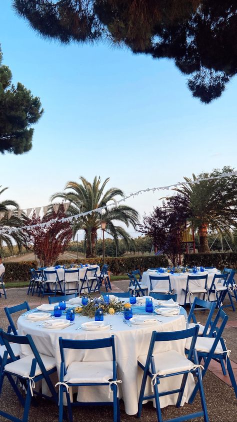 Round, white & blue tables. Mamma mia inspo. Greece. Mamma Mia Outdoor Party, Mama Mia Hoco Theme, Greece Themed Birthday Party, Mama Mia Centerpieces, Mama Mia Prom Theme, Mamma Mia Birthday Party Aesthetic, Mamma Mia Aesthetic Birthday, Mamma Mia Table Decor, Mamma Mia Picnic