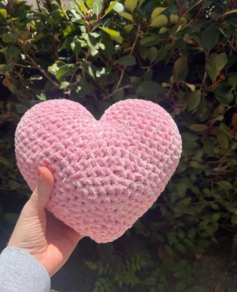 Rose pink crocheted heart pillow. Great for decoration, a stress pillow or practical use! Made with soft chenille yarn. Measures 8x8, circumference of 20.5in. Crochet Ideas Pillow, Crochet Plushies Pink, Small Pink Crochet Projects, Room Decor Crochet Ideas, Pink Things To Crochet, Pink Crochet Plushies, Cute Crochet Pillow, Heart Crochet Pillow, Cute Pink Crochet