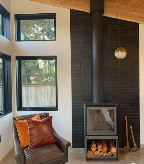 Modern Stove Fireplace Ideas, Black Tile Wood Stove, Wood Stove Wall Protection, Black Brick Wood Stove, Black Brick Behind Wood Stove, Tiled Wood Stove Surround, Wood Burning Stove Tile Ideas, Wood Stove Surround Modern, Woodstove Heat Shield