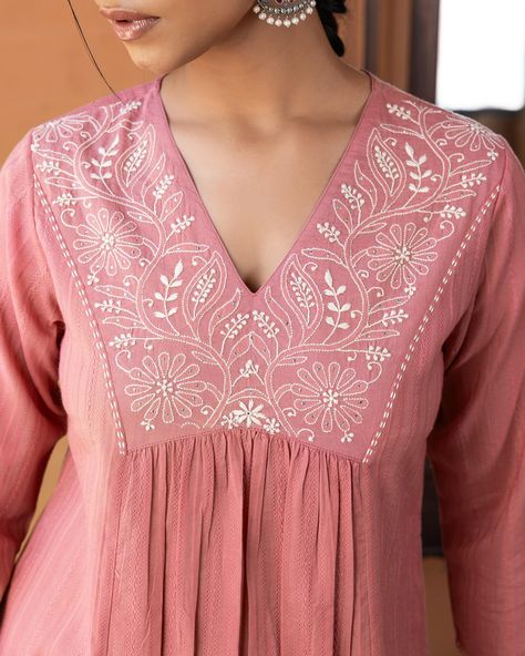 ~NOOR~ Charming Chikankari - New Arrivals! Coral pink dobby with floral motifs in Chikankari is unique and appealing. Pink is a cheerful colour and popular for its vibrant yet soft look. The v-neck draws attention with its beautifully handcrafted embroidery. [ Cottons Jaipur, Cotton, Chikankari, Lucknow, Handcrafted, Hand-embroidered, Craftmanship ] #cottons #cottonsjaipur #newarrivals #chikankari #chikankariembroidery #handembroidery #indiancraft #craftmanship #indianart #threads #cotton... Embroidery Motifs Unique Patterns, V Neck Kurti Design, Cottons Jaipur, Embroidery Designs For Kurtis, Coral Embroidery, Neck Drawing, Style Kurti, Hand Embroidery Dress, Kurti Patterns