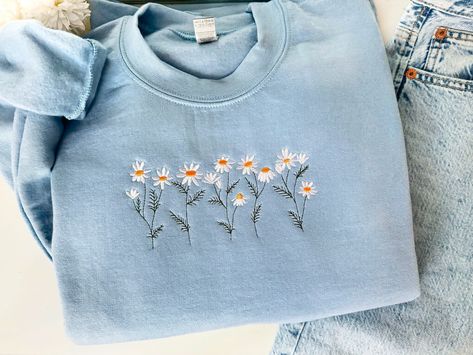 Daisy Embroidered Sweatshirt, Flower Sweatshirt, Gift For Her/Bestfriend, Floral Crewneck, Cute Embroidered Shirt, Embroidered Wildflower These Gildan 18000 sweatshirts are likely to become your new favorite! Super soft & lightweight. What more could a girl ask for, right? How about a spectacular message to help you put out into the world? We have you covered there, too! We use the best quality print material. Ideal for any situation, a unisex heavy blend crewneck sweatshirt is pure comfort. The Embroidered Flower Sweatshirt, Cute Crewneck Sweatshirt, Embroidery Crewneck, Cute Crewneck, Boutique Inspiration, Outfit Essentials, Flower Sweatshirt, Casual Preppy Outfits, Embroidery Monogram