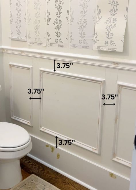 installation of picture frame molding on a wall with text overlay showing the space between each piece of trim Art Over Picture Frame Molding, Picture Frame Wall Molding Ideas, Box Molding Small Bathroom, Box Wall Trim, Picture Frame Molding Half Bath, Double Picture Frame Molding, Picture Frame Molding Half Wall, Picture Framing Wall Molding, Chair Rail Molding Ideas