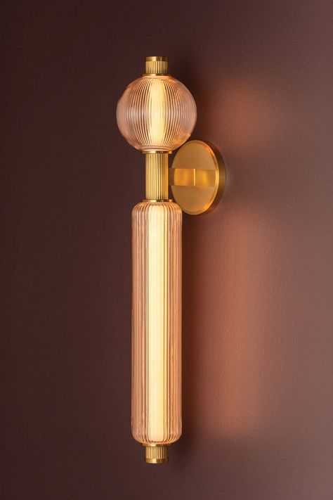 A nature-inspired spin on an iconic mid-century sputnik design, Atom brings a burst of illumination to modern interiors. This dynamic composition features glass spheres and cylinders that are brilliantly lit by energy-efficient LEDs. The reeded detailing of the arms is accented by smooth metalwork in a Vintage Brass finish. Atom is available as a 2-light wall sconce and 10 or 13-light chandeliers. *When applicable, we may remove wiring from images. *Please note, our fixtures do not come with bulbs, you may add the appropriate bulbs as an accessory. Reeded Glass Chandelier, Bathroom Lamps Wall, Mid Century Wall Light, Chelsom Lighting, Mid Century Sconces, Interior Lighting Ideas, Mid Century Modern Wall Lamp, Mid Century Modern Sconces, Deco Pendant Light