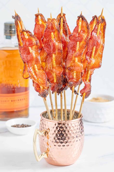 These Brown Sugar Bourbon Candied Bacon Skewers are slathered with a brown sugar bourbon glaze and caramelized for a sweet and savory treat. Bacon Jam Crostini, Brown Sugar Bourbon Glaze, Bacon Skewers, Bourbon Bacon Jam, Delicious Holiday Desserts, Brown Sugar Bacon, Bourbon Glaze, Bourbon Tasting, Fall Brunch