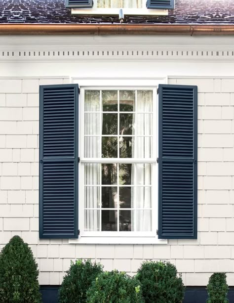 White House Dark Blue Shutters, White House Dark Gray Shutters, Linen Color Siding Exterior, White Colonial Blue Shutters, Grey House Shutters, Light Grey Siding House With Shutters, Tan House With Blue Shutters, Shutters On Cream House, Shutter Colors For Light Grey House