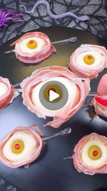 Genevieve LaMonaca on Instagram: "Antipasto Eyeballs 👁️ Follow @chefgenevieve for 30 Halloween inspired recipes   Ingredients:  8oz Ciliegine (cherry sized) mozzarella balls  12 Pimento stuffed Manzanilla olives  12 slices prosciutto   Directions:  Add mozzarella balls to a bowl and cover with hot water (about 185°F) Allow to sit for 3 minutes to warm the mozzarella enough to shape.   Use two balls to form into 1 larger ball. While still warm, shape into a smooth round ball. Poke a hole in the center using your pinky finger then push in an olive.   Cut prosciutto into 4 long strips and wrap around the mozzarella eyeball. Secure with a skewer  Enjoy! 👻  #antipasto #halloweenfood #halloweeninspo #edibleeyeballs" Halloween Mozzarella Eye Balls, Antipasto Eyeballs, Adams Family Halloween, Edible Eyes, Mozzarella Balls, Mozzarella Recipes, Pinky Finger, Monster Eyes, Adams Family