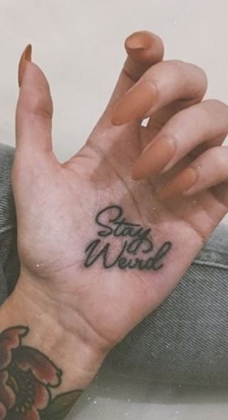 Finger Tattoos Inner, Stay Weird Tattoo Ideas, Palm Tattoos Hand, Traditional Script Tattoo, Traditional Hand Tattoos For Women, Hand Script Tattoo, Tattoo On Palm Of Hand, Traditional Tattoo Script, Script Hand Tattoo