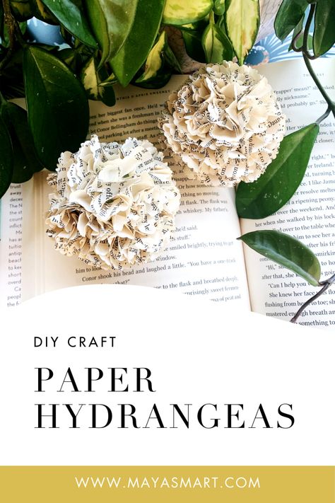 Make delicate hydrangea blossoms out of old book pages with this DIY book craft, a simple project that offers a literary twist on classic paper flowers. Follow three steps to create decor that’s perfect to display around the house, feature as centerpieces at a festive meal, or complete a reading theme for a child’s birthday party. What a pretty way to spotlight literacy and bring a touch of nature into your home! Book Page Flowers Diy Easy, Recycled Flowers Crafts, Flowers From Book Pages Diy, Book Page Paper Flowers, Book Page Flowers How To Make, Flowers Made Of Book Pages, Diy Newspaper Flowers, Paper Flowers From Old Books, How To Make Flowers Out Of Book Pages