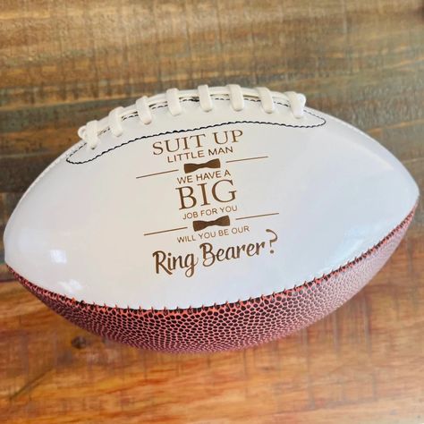 "FOR UNITED STATES FREE SHIPPING ORDERS OVER $35 AND 25% OFF STORE WIDE YEAR END SALE These Ring Bearer, Jr. Groomsman proposal footballs are a great way to ask the little guys to be on your team for that special day! The engraving comes out to a warm brown color with easy to read contrast. This is an \"engraved\" football and when engraved into the leather it is permanent and reveals the natural brown color. There is NO other color option available. The engraving will last forever and will not Football Rings, Ring Bearer Proposal, Ring Bearer Gift, Junior Groomsmen, Year End Sale, Groomsman Proposal, Ring Bearer Flower Girl, Western Rings, Ring Bear