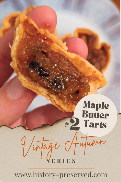 hand holding maple butter tart cut in half showing golden gooey filling with raisins and a flakey crust Maple Butter Tarts Recipe, Maple Syrup Butter Tarts, Maple Butter Tarts, Butter Tarts With Maple Syrup, Butter Tart Filling Recipe, Apple Butter Tarts, Butter Tarts Filling Recipe, Maple Tarts, Colonial Recipes