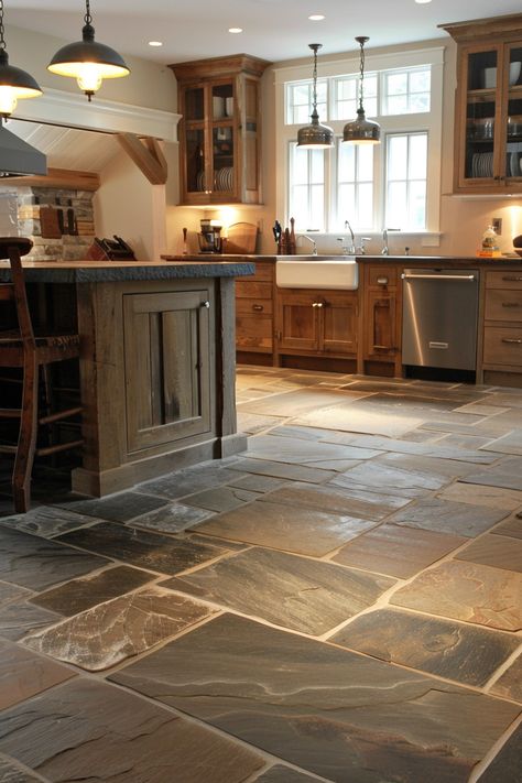 Add a unique twist to your kitchen with farmhouse kitchen flooring options that combine rustic and modern elements. 🏡🍴 Rustic Flooring Tile, Dark Stone Kitchen Floor, Rustic Floor Tiles Living Room, Kitchen Floor Next To Hardwood, Farmhouse Kitchen With Tile Floor, Non Wood Kitchen Floors, Rustic Kitchen Flooring Ideas, Log Cabin Flooring Ideas, Rustic Flooring Ideas