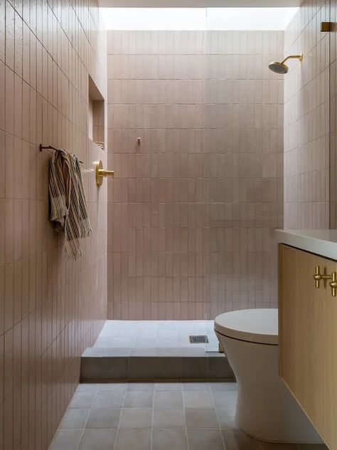 The white zellige tile across one bathroom’s wall matches the material of those used by the pool, but the ochre-hued squares lining the floor riff on their shape. Meanwhile, the primary suite’s shower is outfitted in rectangular tile, and the ones in the ADU office’s pink bathroom have the same look. Zia Tile Bathroom, Square Tile Bathroom, Zia Tile, Wood Walkway, Organized Lifestyle, Glazed Brick, Primrose Hill, Living Room Design Inspiration, Square Tile