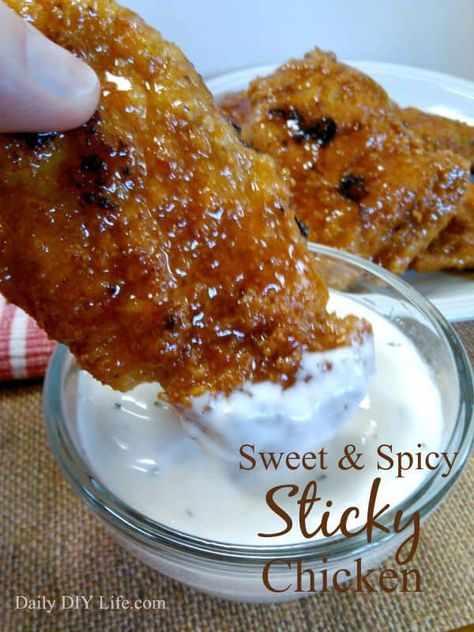 A golden brown crunchy chicken tender is coated with a sweet and spicy glaze to make this mouth-watering chicken dish a huge hit with everyone. My favorite part of all.. it is BAKED not fried! That makes them a bit more healthy for you than the deep-fried, covered in grease traditional chicken fingers. Sweet & Spicy Sticky Chicken Recipe! | DailyDIYLife.com Spicy Sticky Chicken, Sticky Chicken Recipe, Spicy Chicken Tenders, Crunchy Chicken Tenders, Bread Crumb Chicken, Easy Suppers, Fiber Recipes, Crunchy Chicken, Baked Chicken Tenders