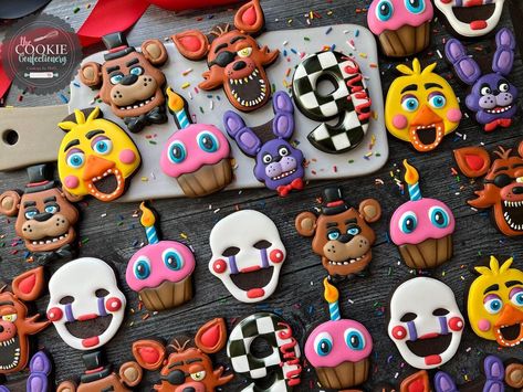 Five Nights at Freddy’s Cookies for Lucas’ 9th birthday today. He begged for this party theme but I don’t quite understand the obsession… | Instagram Five Night At Freddys Birthday Ideas, Five Nights Of Freddy Cake, Fnaf Security Breach Birthday Party, Five Nights At Freddy's Birthday Cake Ideas, Five Nights At Freddy’s Cookies, Fnaf Party Food Ideas, 5 Nights At Freddys Birthday Ideas, Five Nights At Freddy's Party Ideas, Five Nights At Freddy’s Birthday Party