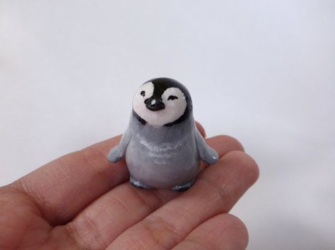 This figurine of baby penguin is completely handmade from a polymer clay. Then painted with acrylic paint and finished with glossy varnish. Size: 3,5 cm ( 1,3 inch) The figurine arrives in a gift handmade box. Please, dont use it as a toy for small children. More of unique gifts you Polymer Clay Small Figures, Clay Penguin Sculpture, Penguin Clay Art, Small Clay Animals, Tiny Clay Things, Penguin Habitat, Penguin Pottery, Penguin Ceramic, Polymer Clay Penguin